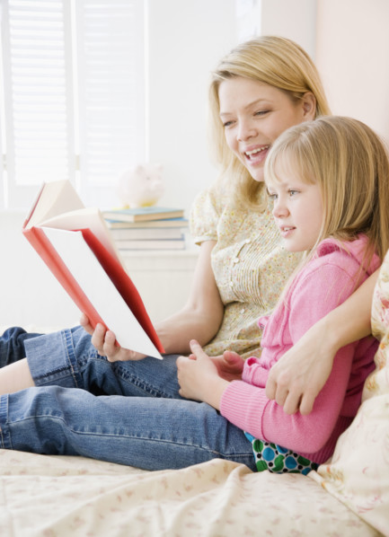 Mother reading to daughter. Date : 2008