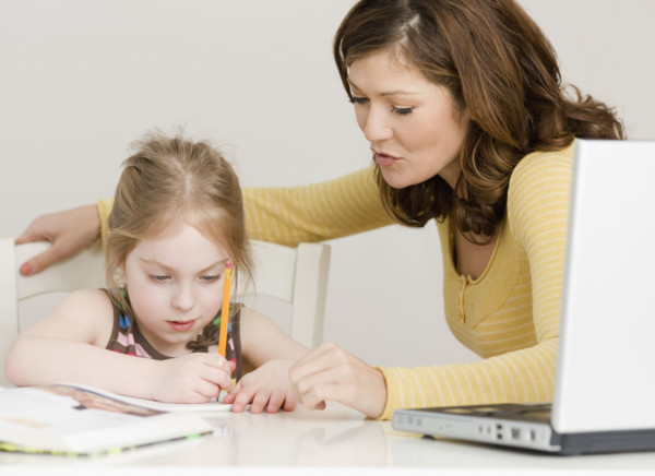 Mother helping daughter with homework. Date : 2008