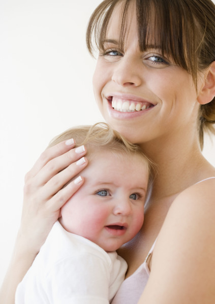 Mother hugging baby. Date : 2008