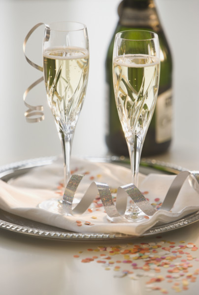 Glasses of champagne on tray.