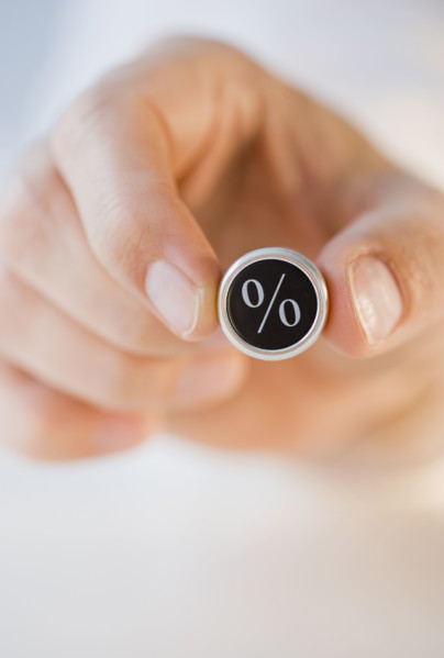 Man holding percent symbol .