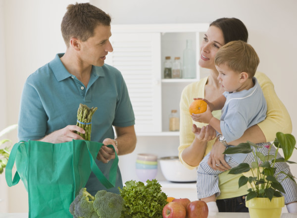 Family unpacking groceries.