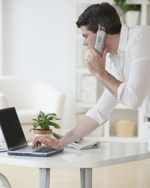 Man talking on telephone.