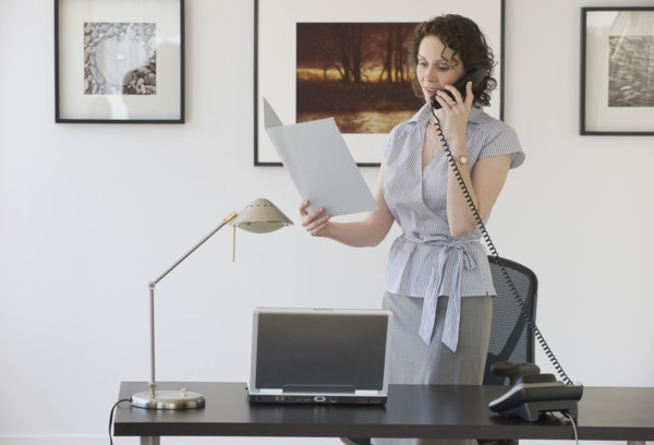 Businesswoman talking on telephone.