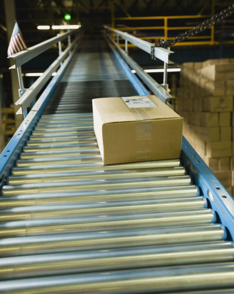 Package on conveyor belt in warehouse. Date : 2008