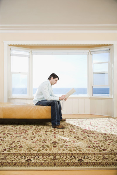 Man reading newspaper. Date : 2008