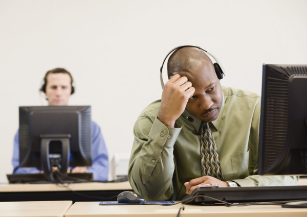 African businessman wearing headset. Date : 2008