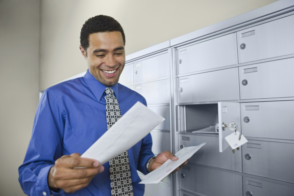 African businessman reading mail. Date : 2008
