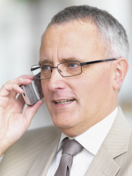 Businessman talking on cell phone. Date : 2008