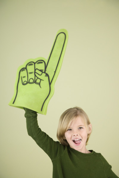 Boy holding foam Number One hand. Date : 2008