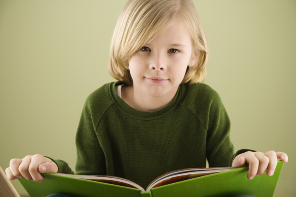 Boy holding book. Date : 2008