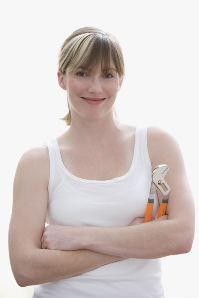 Woman holding wrench. Date : 2008