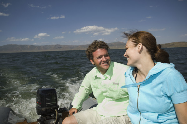 Couple on motorboat, Utah, United States. Date : 2008