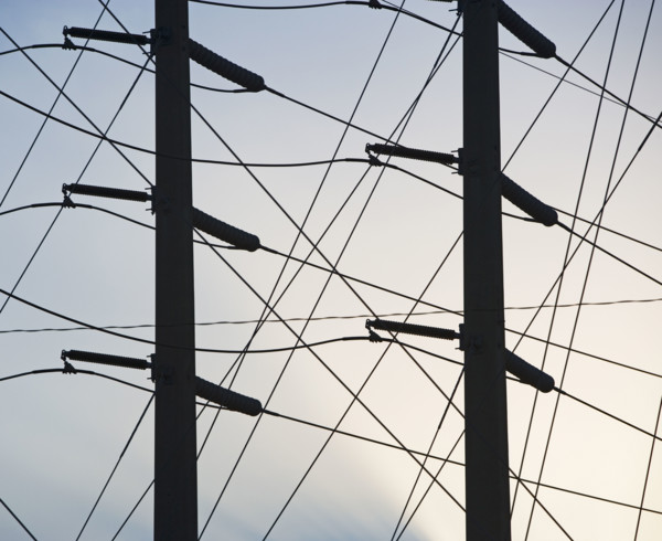 Low angle view of power lines on poles. Date : 2008