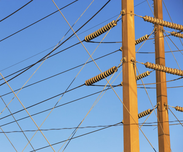 Low angle view of power lines on poles. Date : 2008
