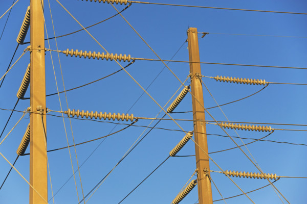 Low angle view of power lines on poles. Date : 2008