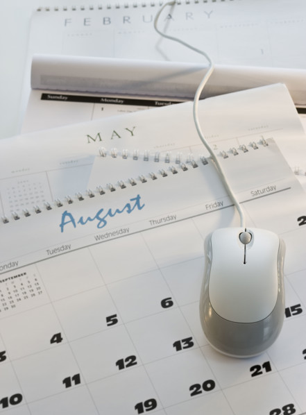 Close up of computer mouse on calendar.