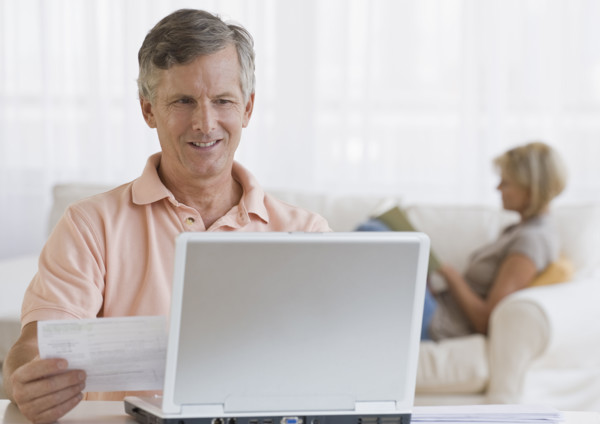 Man paying bills online.