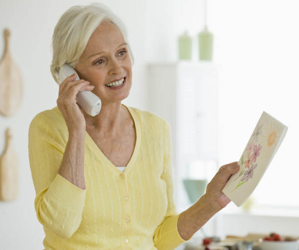 Woman talking on telephone.