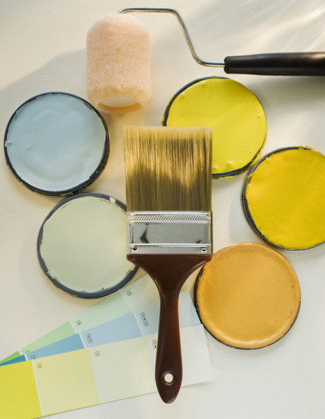 Paintbrushes and assorted paints.