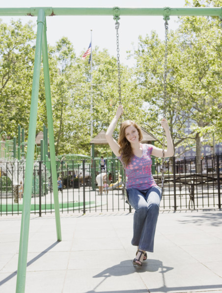 Woman swinging in park. Date : 2008