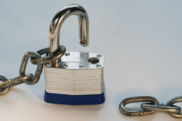Close up of lock and metal chain. Date : 2008