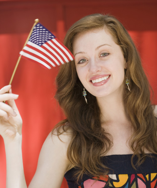 Young woman holding American flag. Date : 2008