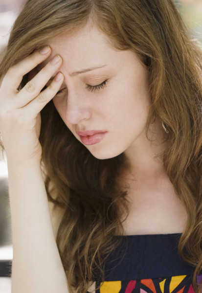 Young woman with headache. Date : 2008
