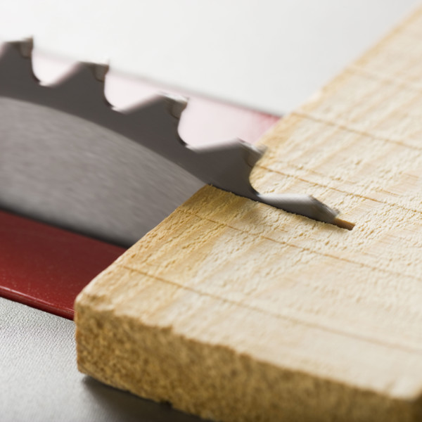 Close up of saw cutting wood.