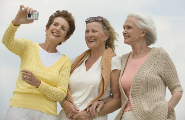 Senior women taking portrait.