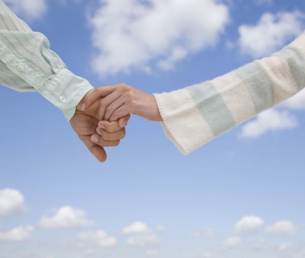 Couple holding hands.