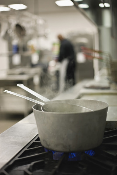 Steaming pots on gas stove. Date : 2008