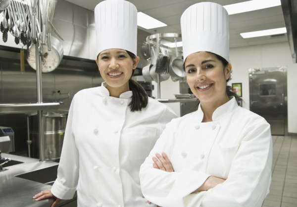 Female chefs posing in kitchen. Date : 2008