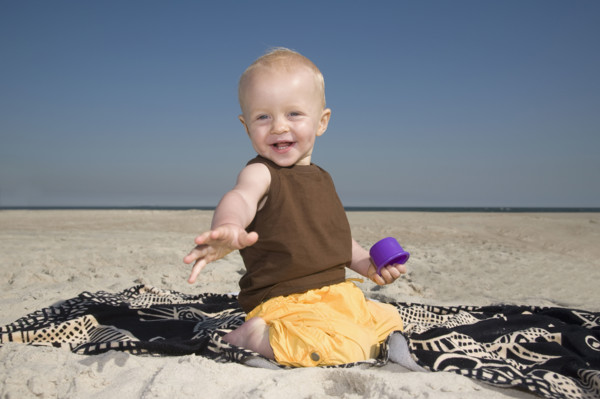 Baby boy playing at beach. Date : 2008