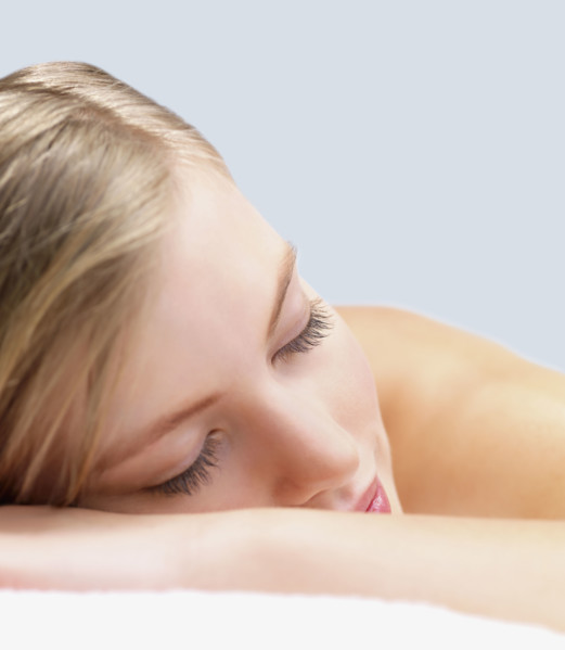 Young woman lying down in massage table. Date : 2008