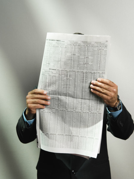 Businessman reading newspaper. Date : 2008