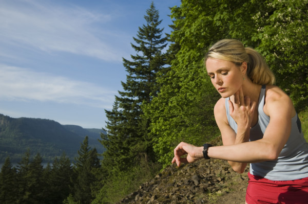 Runner checking heart rate. Date : 2008