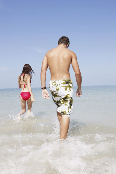 Friends walking in ocean. Date : 2008