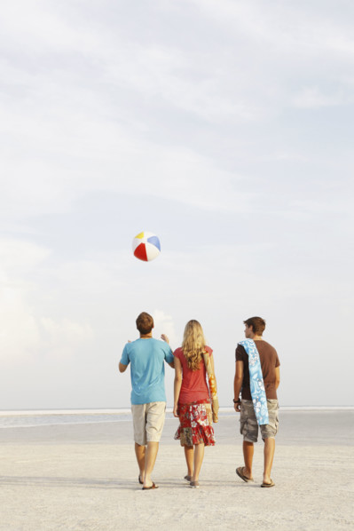 Friends walking on beach. Date : 2008