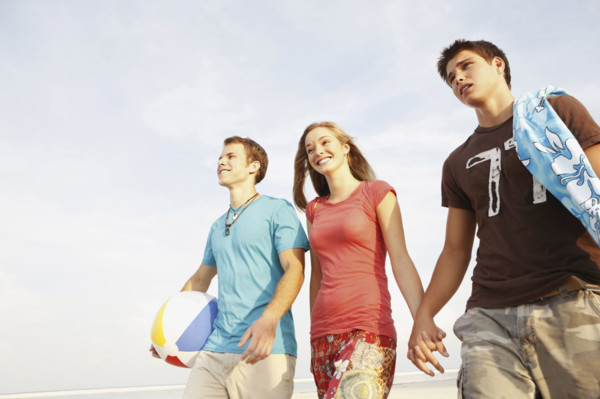 Friends walking on beach. Date : 2008