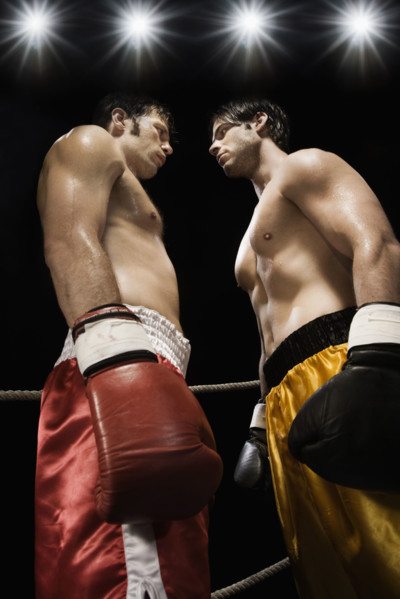 Boxers facing off in boxing ring. Date: 2008