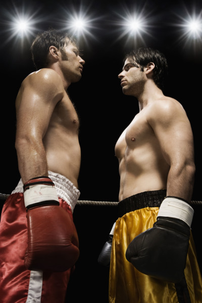 Boxers facing off in boxing ring. Date: 2008