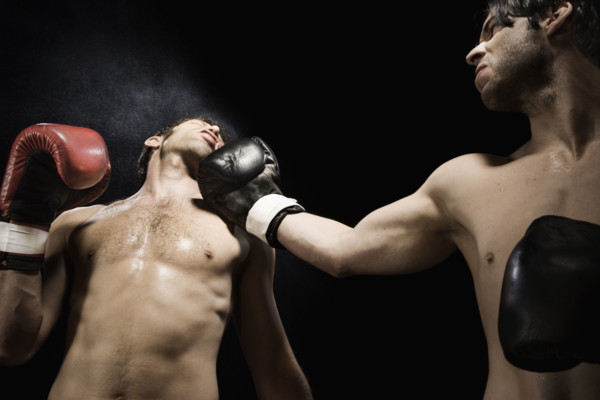 Boxer punching opponent in jaw. Date: 2008