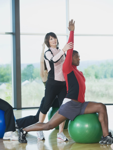 Instructor guiding fitness class. Date : 2008