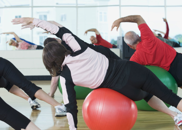 Fitness class stretching on balance balls. Date : 2008