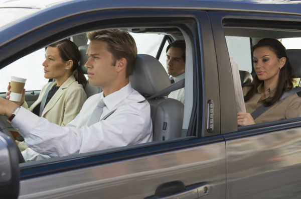 Business people car pooling.