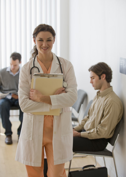 Female doctor posing in waiting room.