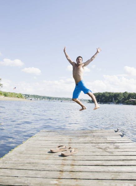 Portrait of man jumping off dock into lake. Date: 2008