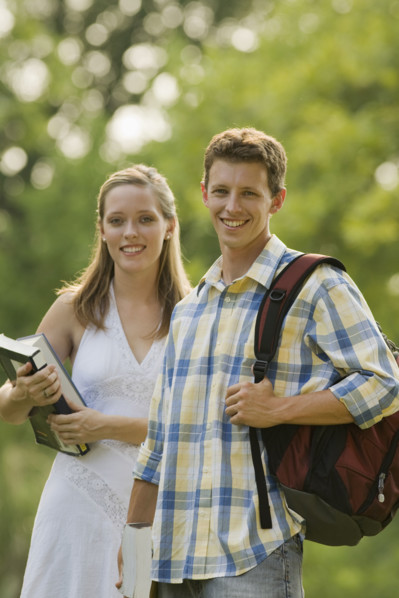 Portrait of college students with books and backpack. Date : 2008