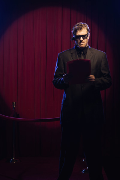 Bouncer looking at guest list. Date : 2008